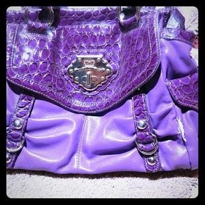 Kathy Van Zeeland purple stylish purse